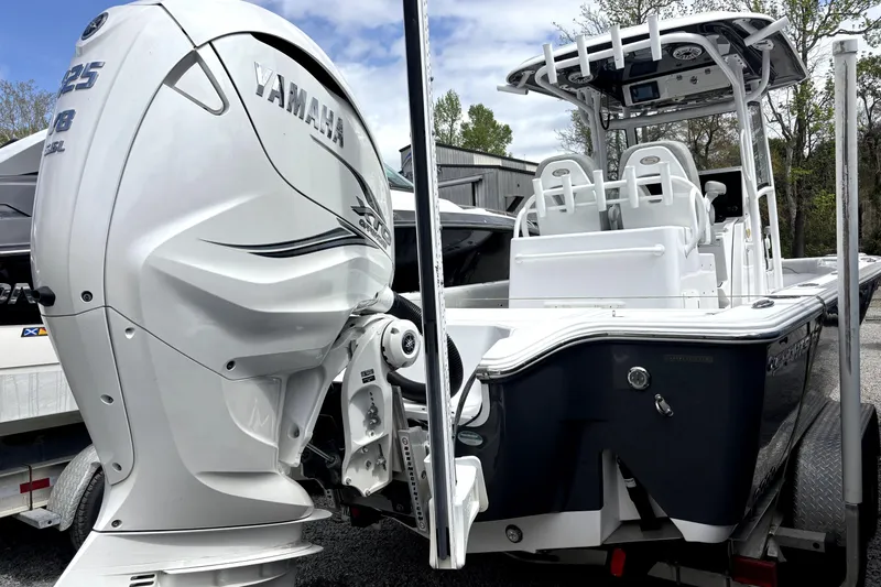 Slide: The Image of 2020 Sportsman Masters 267OE Bay Boat with Yamaha engine, docked outdoors. - 1