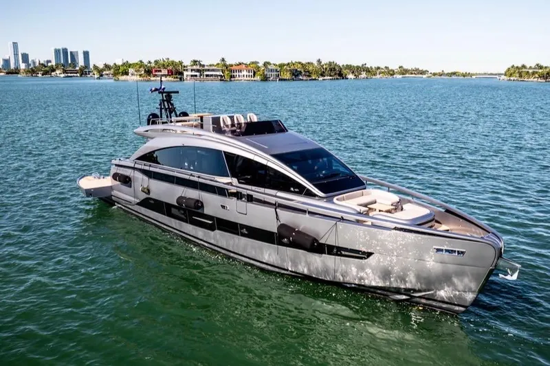 The Image of 2025 Pershing GTX 80 yacht cruising on a sunny day in a scenic bay. - 0