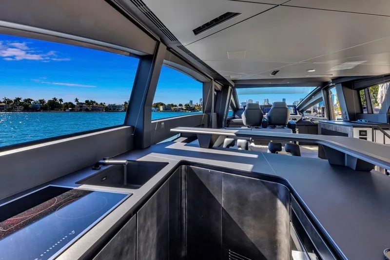 Slide: The Image of Interior view of 2025 Pershing GTX 80 yacht with modern design and ocean backdrop. - 12