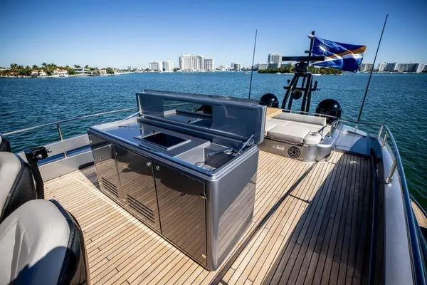 Slide: The Image of Luxurious 2025 Pershing GTX 80 yacht deck with sleek outdoor kitchen and scenic ocean view. - 17