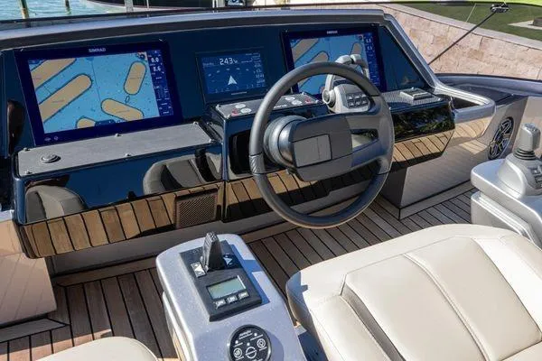Slide: The Image of Cockpit of 2025 Pershing GTX 80 yacht with advanced navigation displays and controls. - 23
