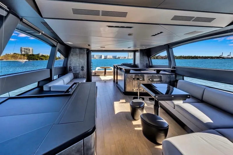 Slide: The Image of Luxurious interior of 2025 Pershing GTX 80 yacht with modern seating and ocean view. - 25