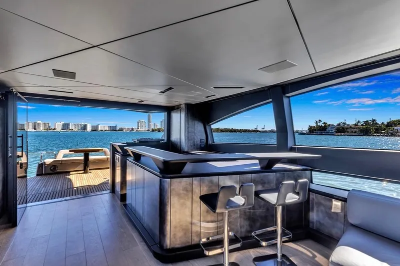 Slide: The Image of Luxurious interior of 2025 Pershing GTX 80 yacht with ocean view and modern bar area. - 27