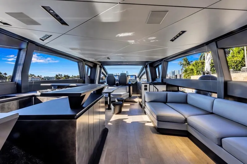 Slide: The Image of Luxurious interior of 2025 Pershing GTX 80 yacht with modern seating and panoramic windows. - 41