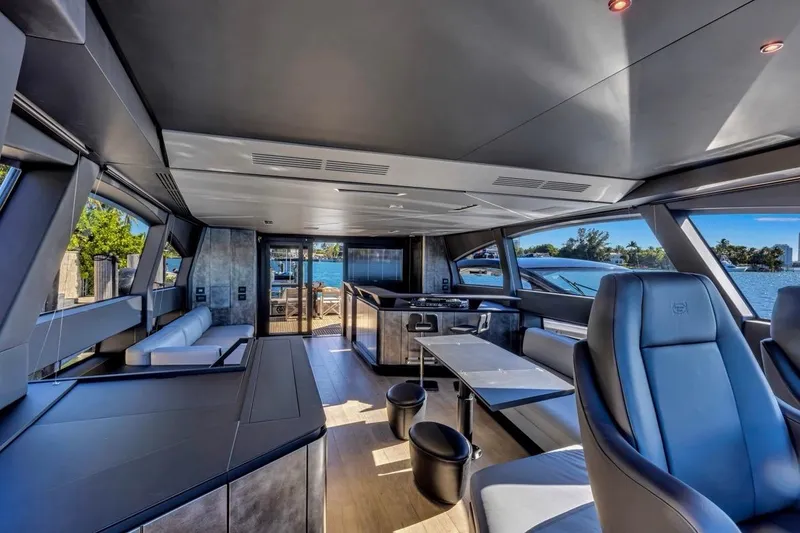 Slide: The Image of Luxurious interior of 2025 Pershing GTX 80 yacht with modern seating and panoramic windows. - 42