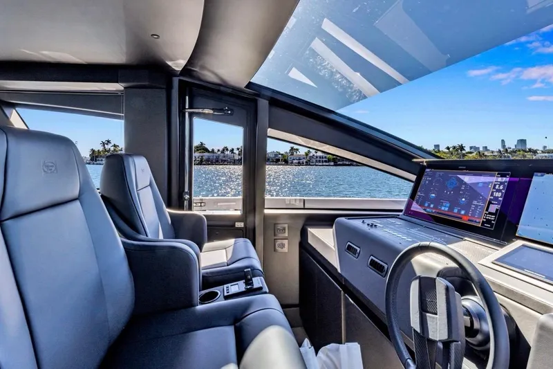 Slide: The Image of Luxurious interior of 2025 Pershing GTX 80 yacht with modern dashboard and scenic ocean view. - 45