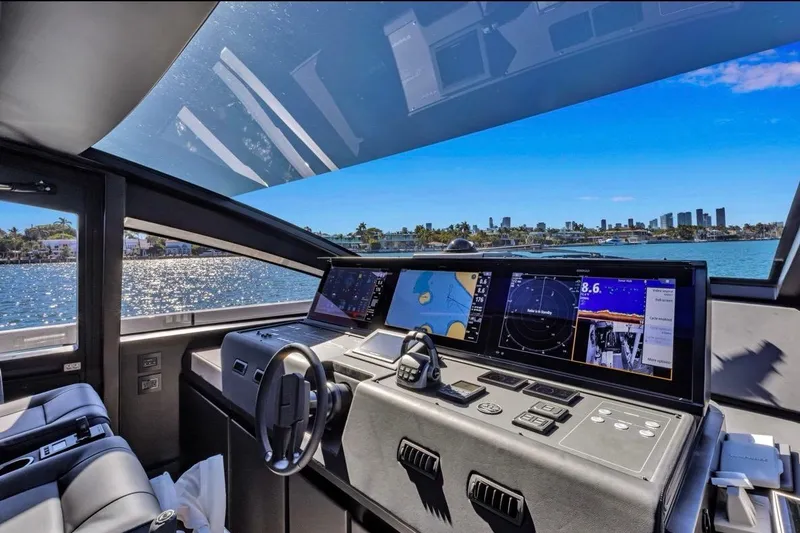 Slide: The Image of Interior view of 2025 Pershing GTX 80 yacht cockpit with advanced navigation displays. - 46