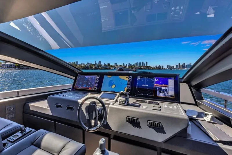 Slide: The Image of Cockpit view of 2025 Pershing GTX 80 yacht with advanced navigation displays. - 47