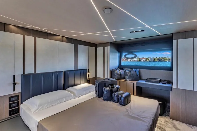 Slide: The Image of Luxurious bedroom interior of 2025 Pershing GTX 80 yacht with modern design and scenic window view. - 54