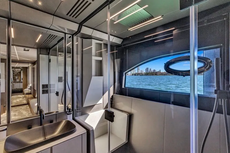 Slide: The Image of Luxurious interior of 2025 Pershing GTX 80 yacht with ocean view through window. - 60