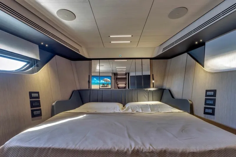 Slide: The Image of Luxurious bedroom interior of 2025 Pershing GTX 80 yacht with modern design elements. - 66
