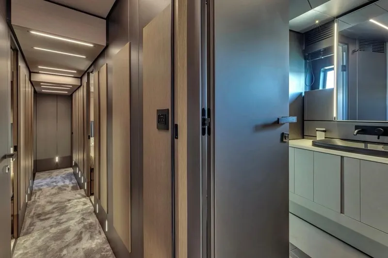 Slide: The Image of Luxurious interior hallway of 2025 Pershing GTX 80 yacht with modern design elements. - 67