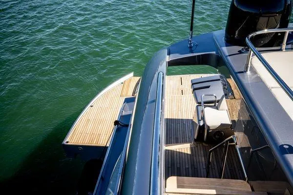 Slide: The Image of 2025 Pershing GTX 80 yacht deck with sleek design and wooden flooring. - 9
