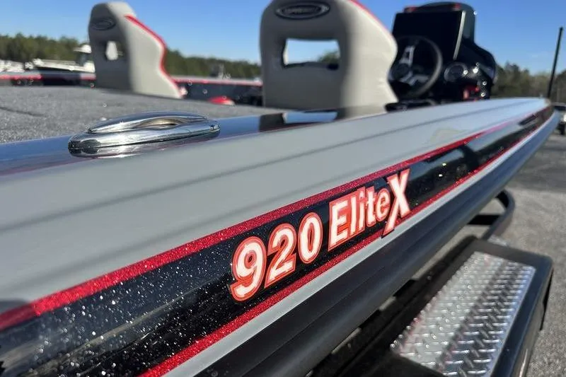 Slide: The Image of Close-up of 2026 Phoenix 921 Elite X boat, showcasing sleek design and branding. - 10