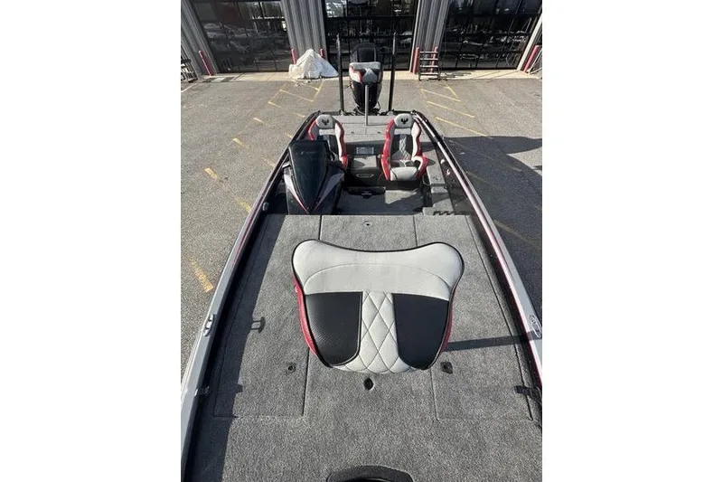 Slide: The Image of 2026 Phoenix 921 Elite X boat interior with seating and carpeted deck. - 11