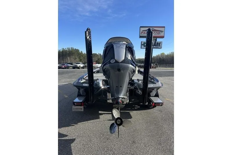 Slide: The Image of Rear view of 2026 Phoenix 921 Elite X boat with powerful outboard motor. - 2