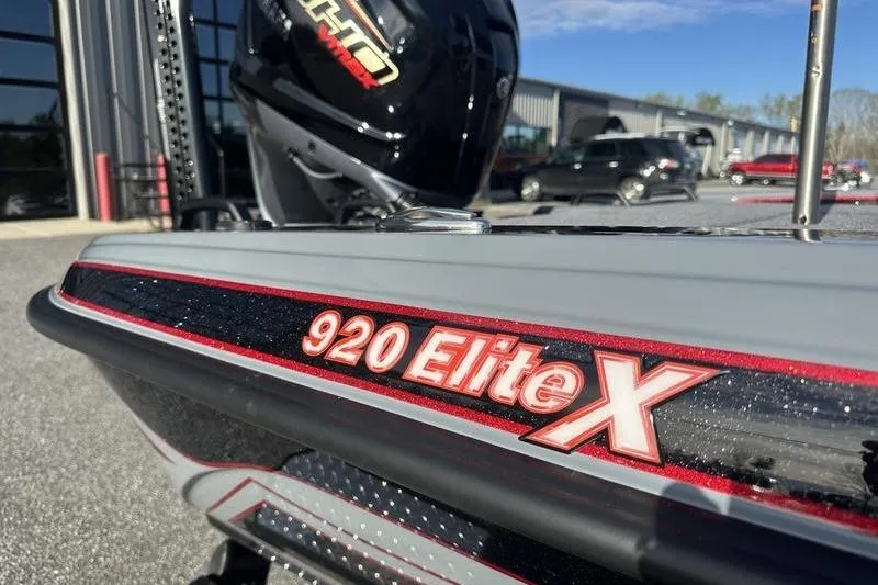 Slide: The Image of Close-up of a Phoenix 921 Elite X boat, showcasing sleek design and branding. - 6