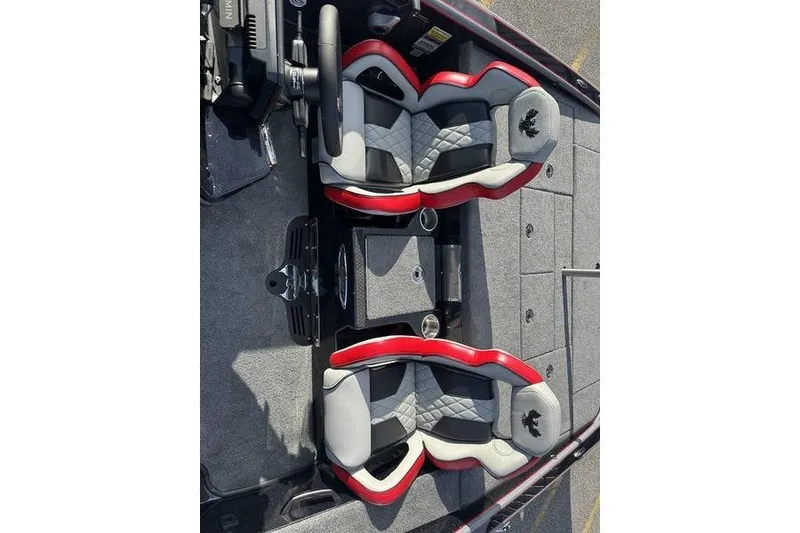 Slide: The Image of 2026 Phoenix 921 Elite X boat interior with red and gray seats, steering wheel, and console. - 9