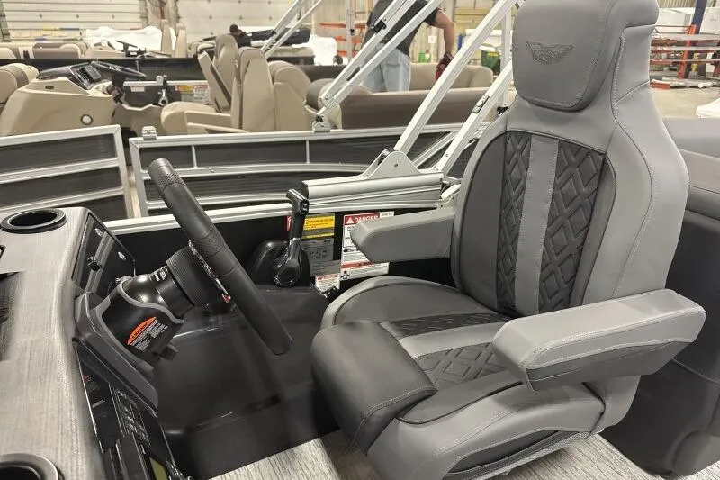 Slide: The Image of Captain's chair and helm of 2026 Bennington 22 MFB pontoon boat. - 11