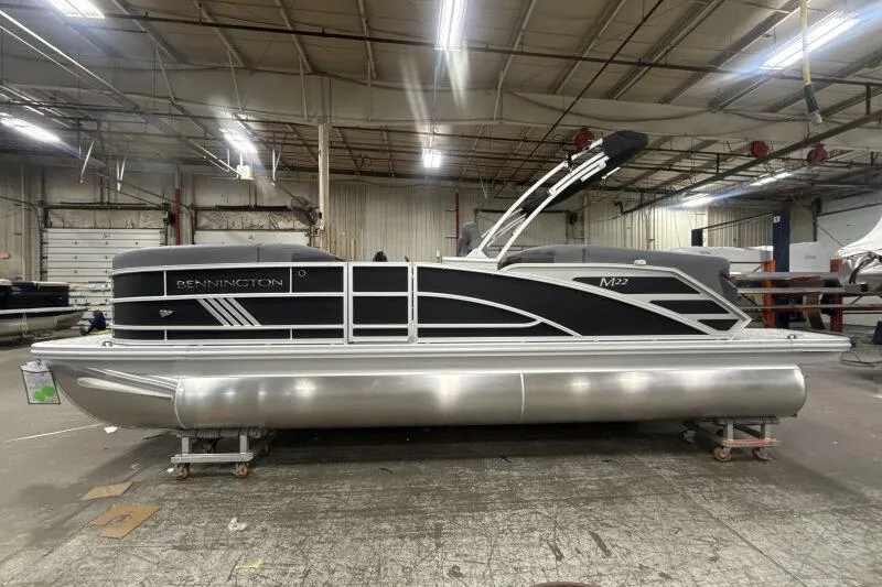 Slide: The Image of 2026 Bennington 22 MFB pontoon boat in a warehouse setting. - 4