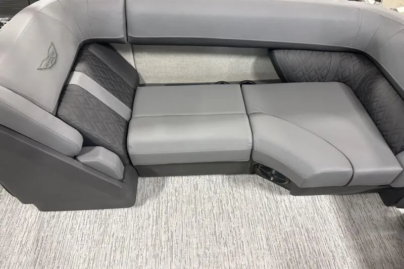 Slide: The Image of 2026 Bennington 22 MFB boat interior with luxurious gray seating and quilted accents. - 9