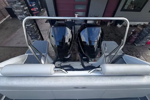 Slide: The Image of 2024 Beneteau Flyer 9 SPACEdeck with dual outboard motors, rear view. - 16