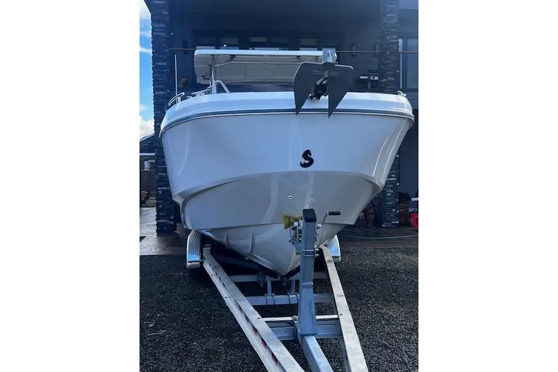 Slide: The Image of 2024 Beneteau Flyer 9 SPACEdeck boat on trailer, front view. - 2