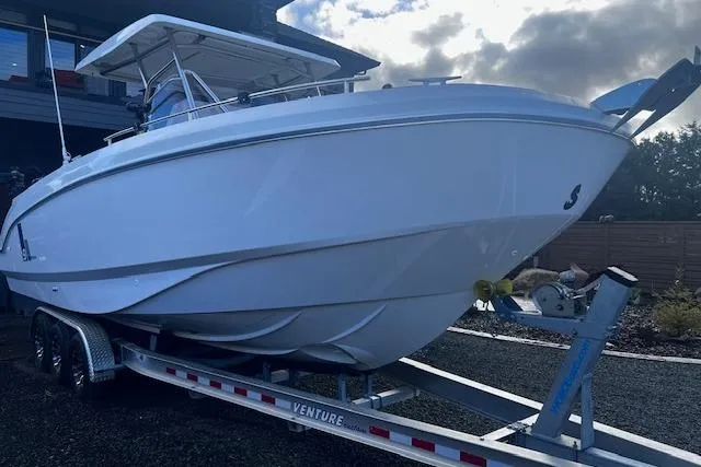 Slide: The Image of 2024 Beneteau Flyer 9 SPACEdeck boat on trailer, side view under cloudy sky. - 3