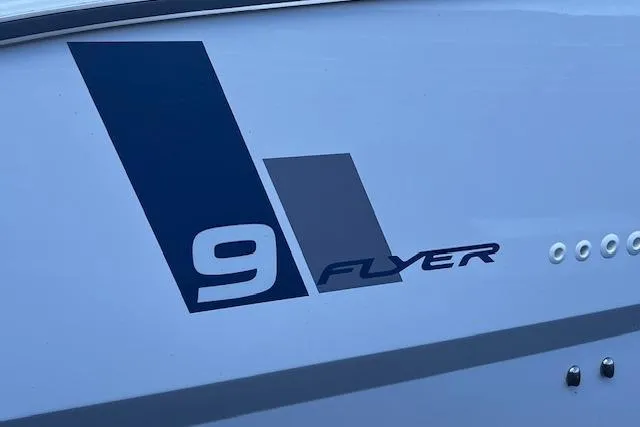 Slide: The Image of 2024 Beneteau Flyer 9 SPACEdeck logo on boat hull. - 4