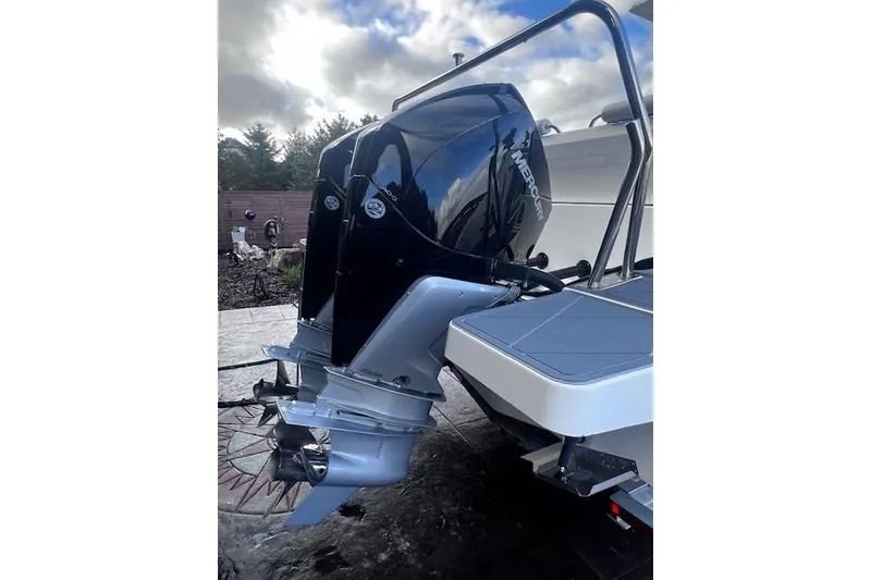 Slide: The Image of 2024 Beneteau Flyer 9 SPACEdeck with Mercury outboard engine, docked outdoors. - 5