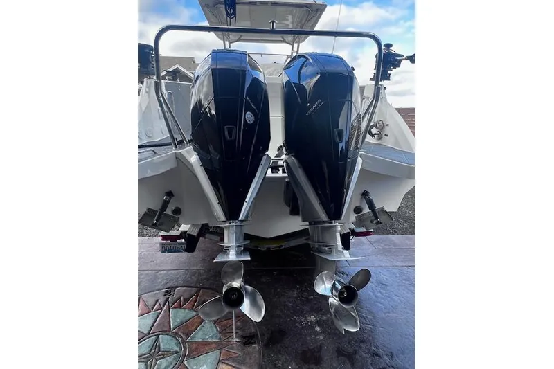 Slide: The Image of 2024 Beneteau Flyer 9 SPACEdeck with dual outboard engines, rear view. - 6