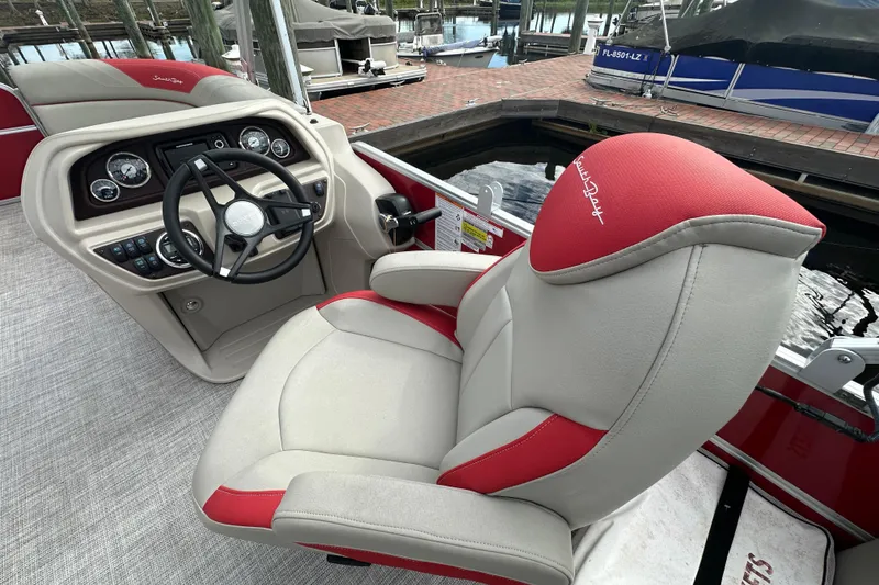 Slide: The Image of Captain's seat and helm of 2022 South Bay Pontoons 24 LE Series Tri Hull. - 12