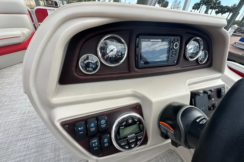 Slide: The Image of Dashboard of 2022 South Bay Pontoons 24 LE Series Tri Hull with gauges and controls. - 16