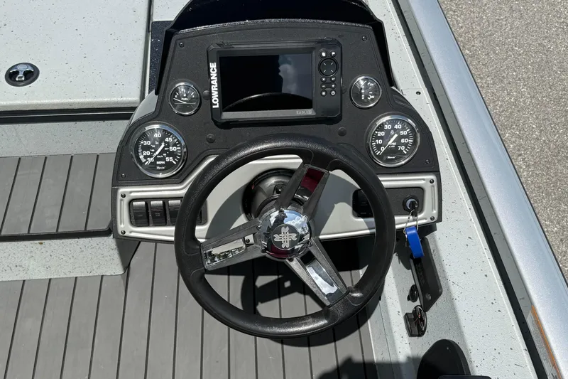 Slide: The Image of 2018 Ranger RT188 boat dashboard with steering wheel and Lowrance display. - 11