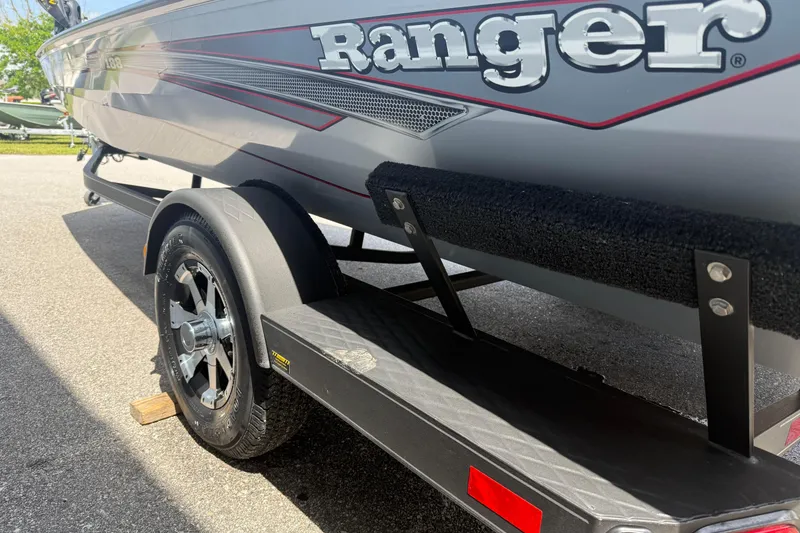 Slide: The Image of 2018 Ranger RT188 boat on trailer, showcasing sleek design and branding. - 5