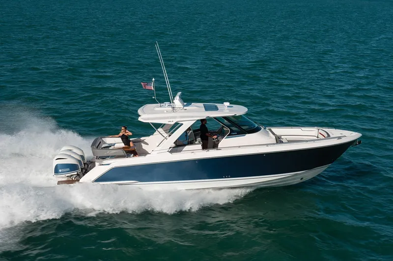 The Image of 2025 Tiara Yachts 38 LS cruising on open water, showcasing sleek design and performance. - 0