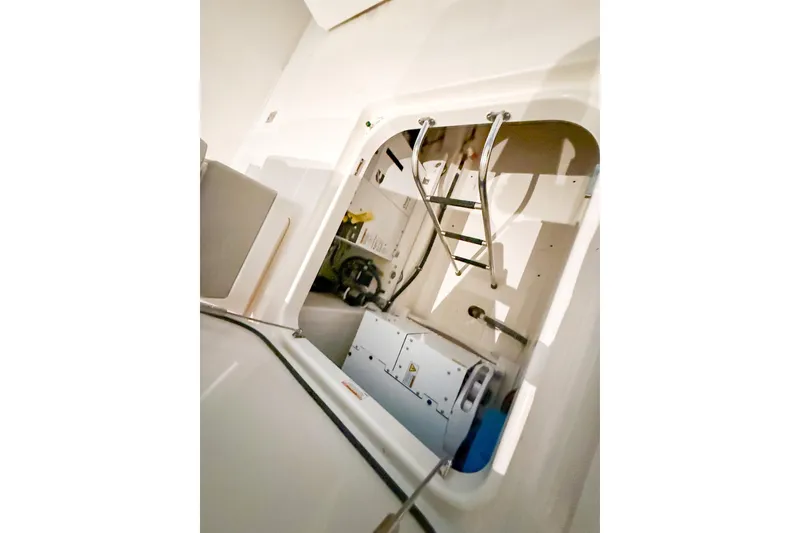 Slide: The Image of Engine compartment of 2025 Tiara Yachts 38 LS with ladder and equipment. - 10