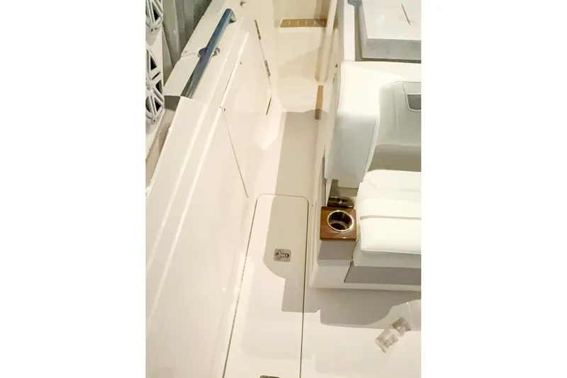 Slide: The Image of Interior view of 2025 Tiara Yachts 38 LS, featuring sleek seating and cup holders. - 11