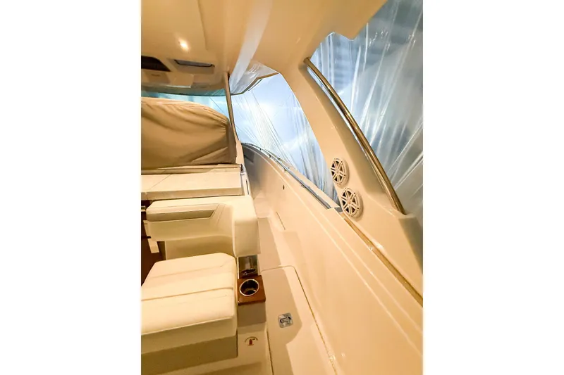 Slide: The Image of Interior view of 2025 Tiara Yachts 38 LS, showcasing seating and sleek design. - 13