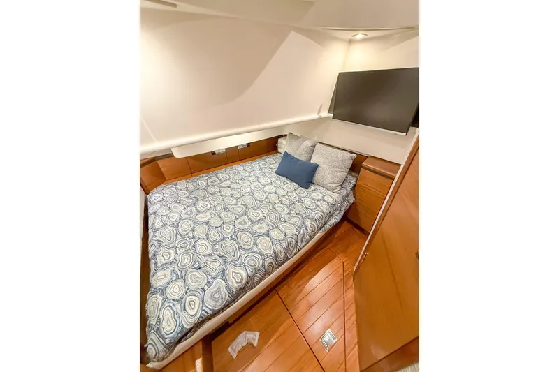 Slide: The Image of Luxurious cabin interior of 2025 Tiara Yachts 38 LS with cozy bedding and modern design. - 22