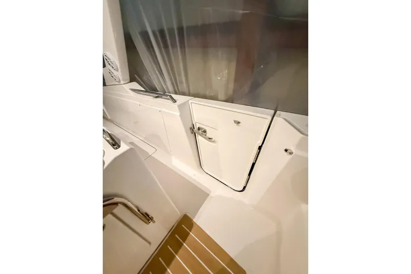 Slide: The Image of 2025 Tiara Yachts 38 LS interior detail with sleek white cabinetry and modern design. - 28