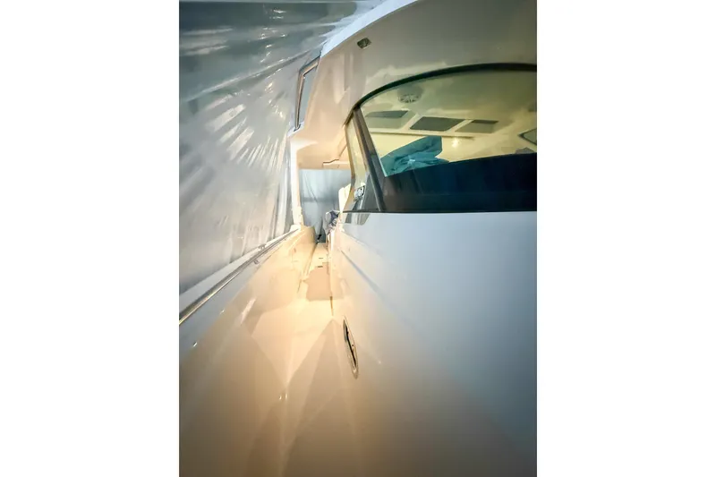 Slide: The Image of 2025 Tiara Yachts 38 LS side view, showcasing sleek design and modern features. - 31