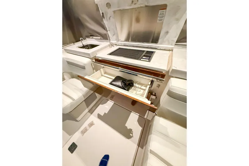 Slide: The Image of Interior view of 2025 Tiara Yachts 38 LS, featuring a sleek kitchen area. - 4