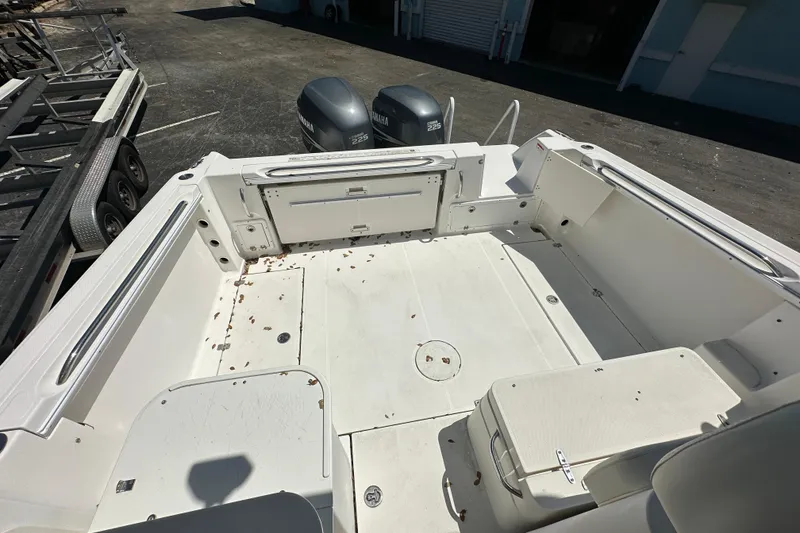 Slide: The Image of 2006 Wellcraft 290 Coastal boat deck with Yamaha engines, spacious and clean layout. - 17