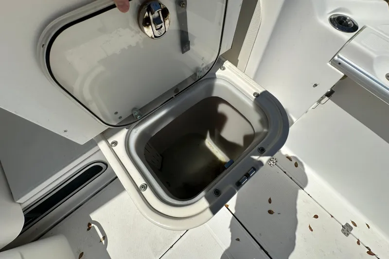 Slide: The Image of Open storage compartment on 2006 Wellcraft 290 Coastal boat deck. - 18