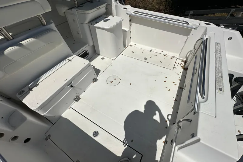 Slide: The Image of 2006 Wellcraft 290 Coastal boat interior with seating and storage compartments. - 20