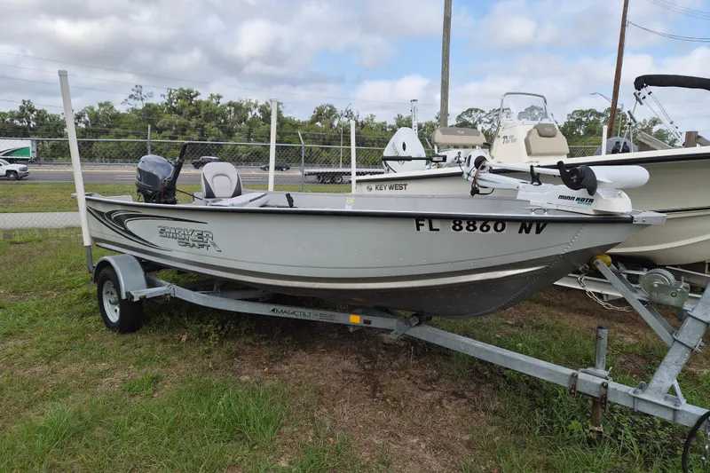 Slide: The Image of 2018 Smoker Craft Angler 16 SC boat on trailer, parked outdoors. - 2