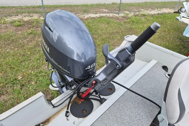 Slide: The Image of 2018 Smoker Craft Angler 16 SC with Yamaha 40HP outboard motor, parked on grass. - 6