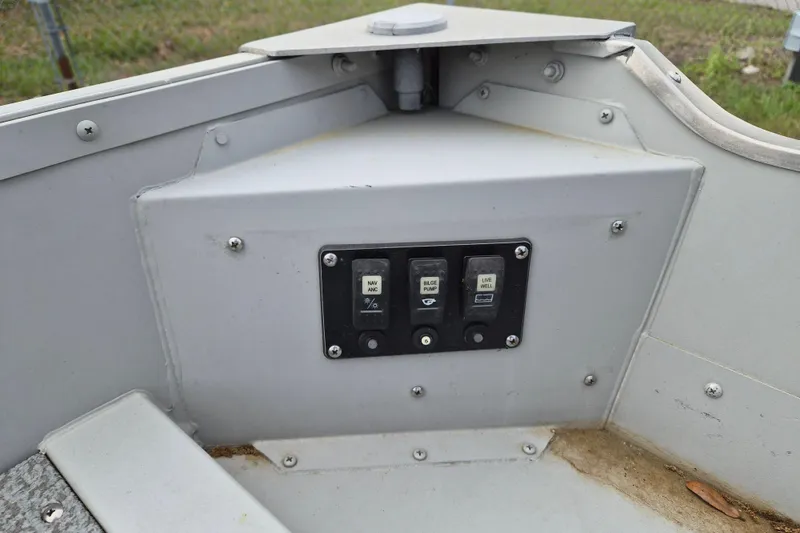 Slide: The Image of Control panel of a 2018 Smoker Craft Angler 16 SC boat with switches. - 7