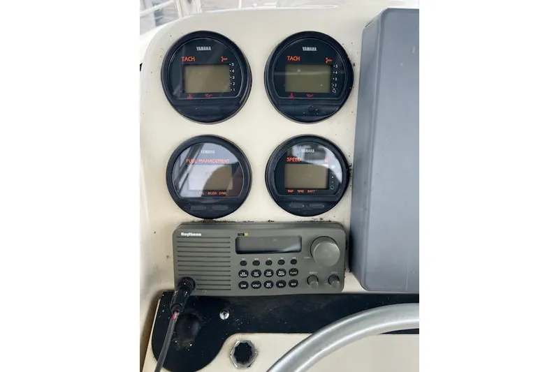 Slide: The Image of Console of 2001 Pursuit 2670 Cuddy Console with Yamaha gauges and Raytheon radio. - 11